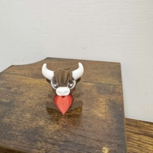 holiday mini highland cow with heart